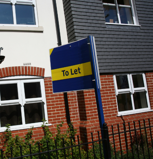 To Let sign outside a modern apartment building in Scotland, representing rental property and private landlord lettings