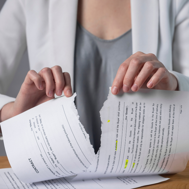 Contract torn in half representing breach of contract in Scotland