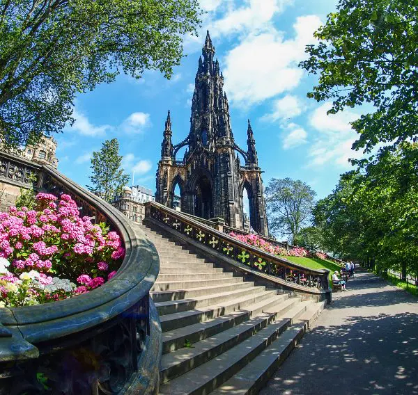 Scott Monument in Edinburgh on a sunny day with flowers – symbolising new beginnings after divorce