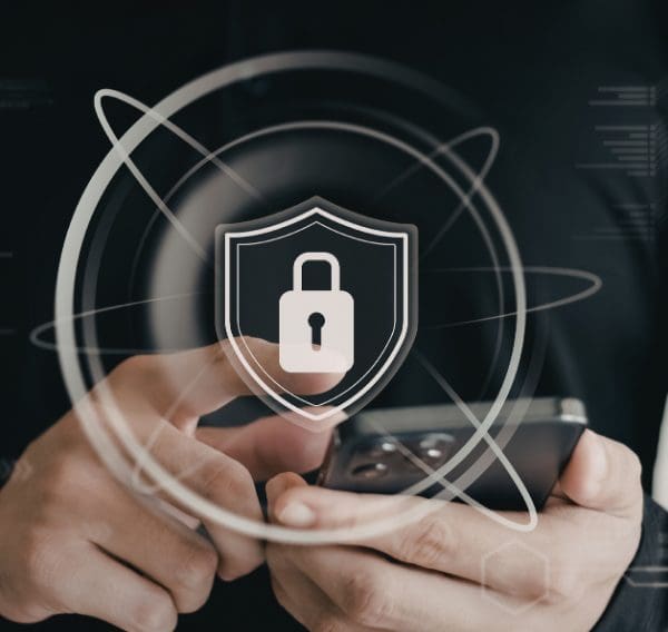 Hand using a smartphone with a white padlock overlay representing data protection, privacy and secure digital communications