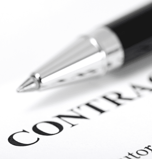 Top of a contract with a pen, representing legal contract review in Scotland