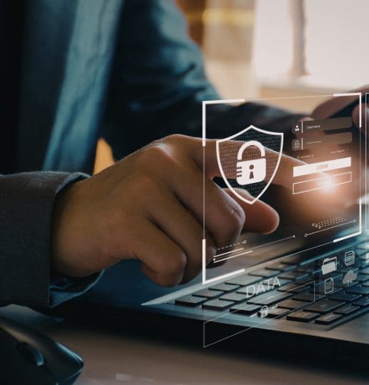 Man typing on a laptop with padlock overlay representing AML and source of funds checks when buying a home in Scotland