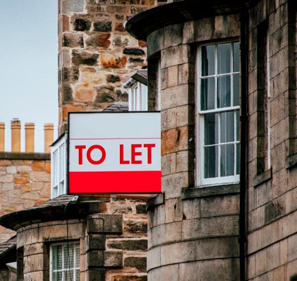 To Let sign displayed outside a residential property on a traditional UK street