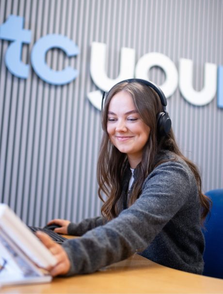 TC Young solicitor answering client call in Glasgow office