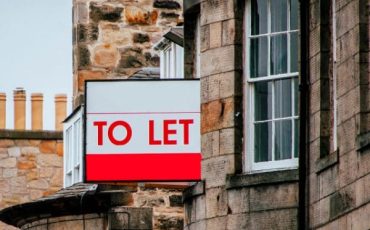 To Let sign displayed outside a residential property on a traditional UK street