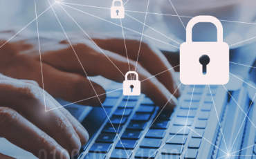 Hands typing on a laptop with padlock icons representing UK data protection and security under the Data Use and Access Act 2025