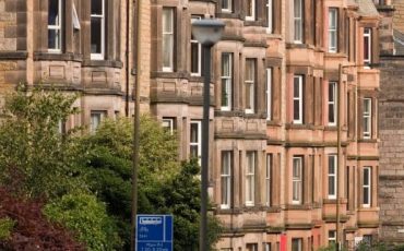 Traditional Scottish tenement block in a residential area, representing the private rented sector.