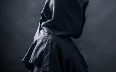 Person in a black cloak symbolising secrecy and strategic gifting for inheritance tax planning