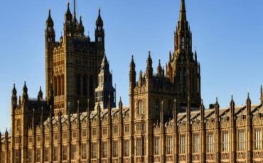 The UK Houses of Parliament in London, viewed from across the River Thames