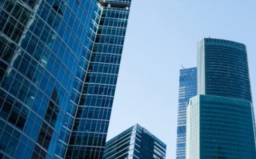 Skyline of modern office buildings in Scotland representing company restoration and corporate legal services